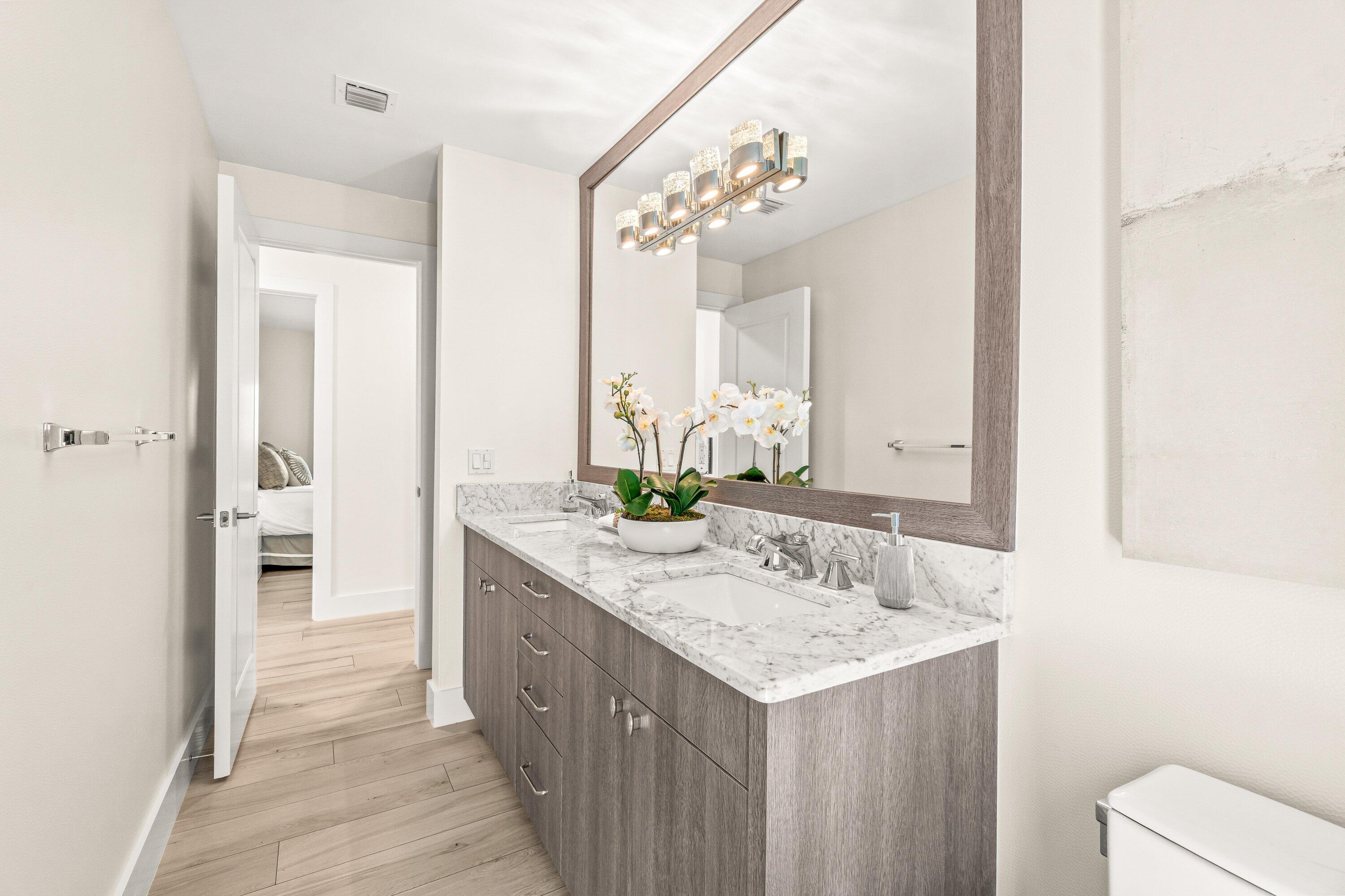 2367 Queen Palm Road Boca Raton, FL 33432 - Photo 33 of 45 a bathroom with a sink and a mirror