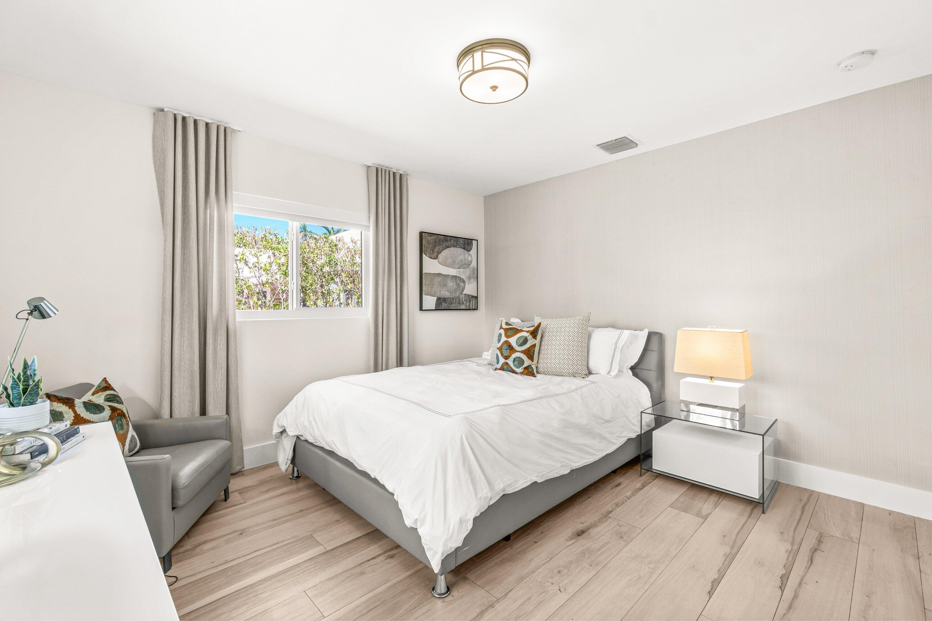 2367 Queen Palm Road Boca Raton, FL 33432 - Photo 35 of 45 a bedroom with a bed and a large window