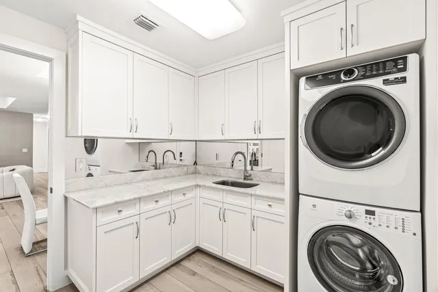 a view of a kitchen with sink washer and dryer