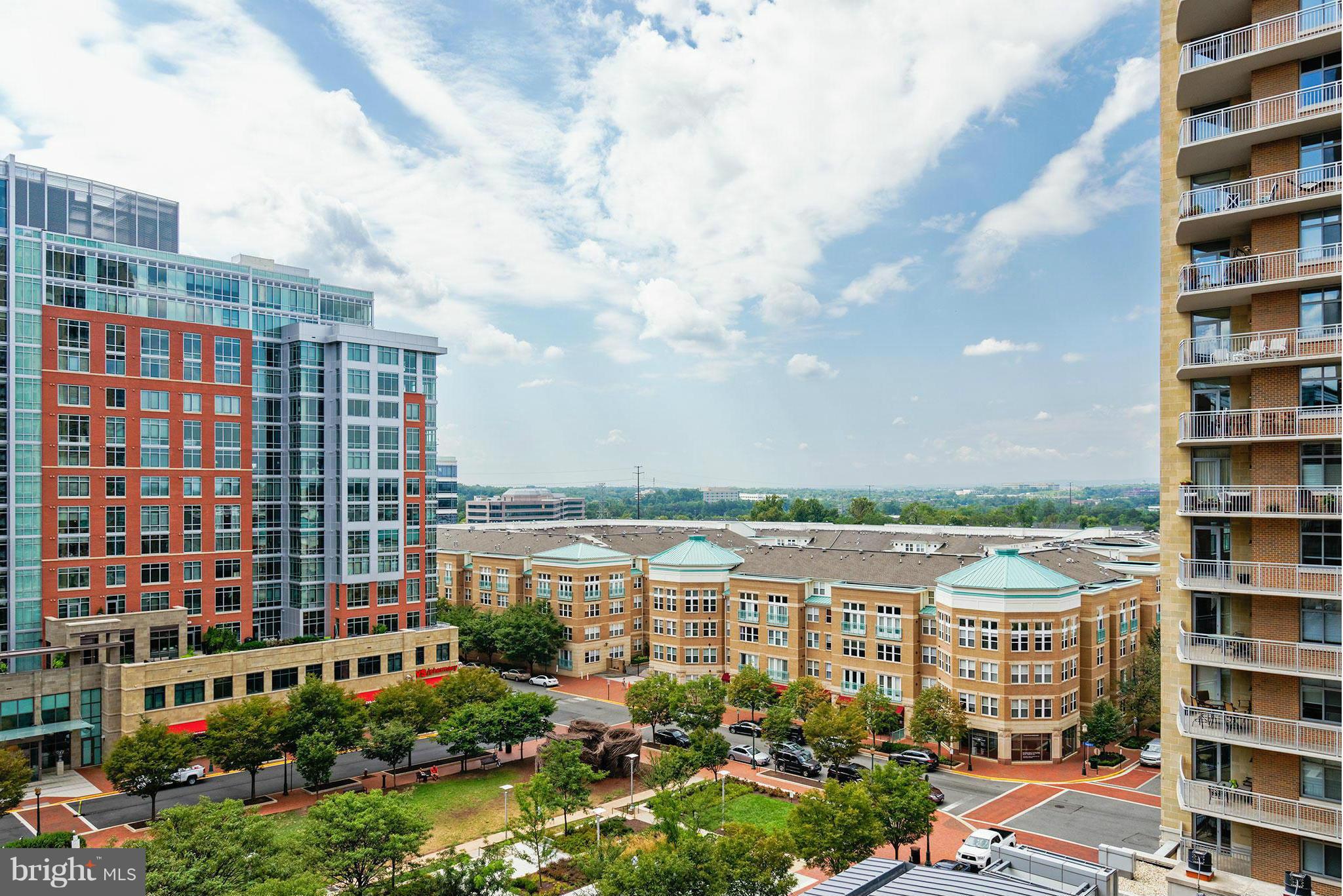 11990 Market Street, Unit 801 Reston, VA 20190 - Photo 2 of 25 a view of a city that has tall buildings