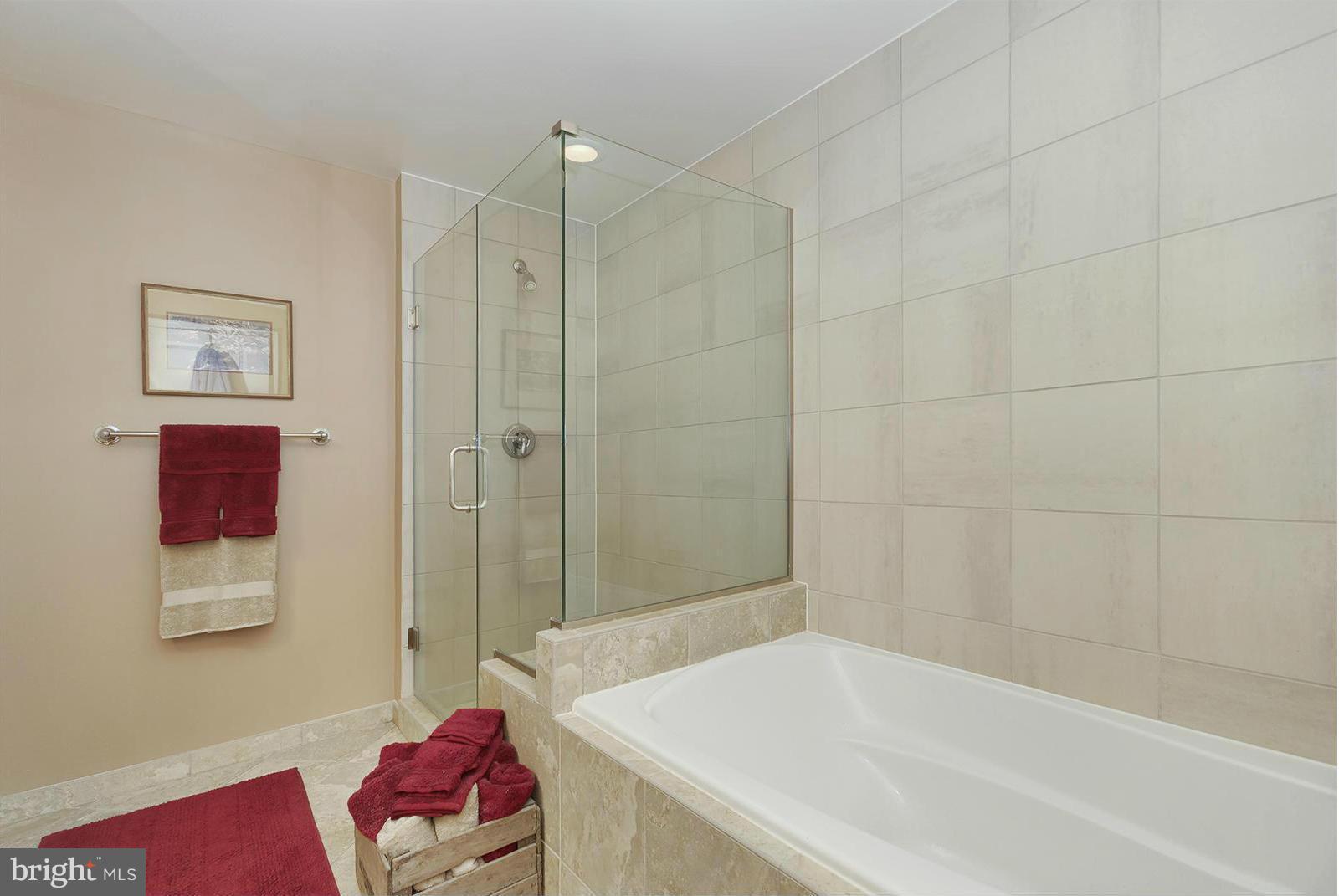 11990 Market Street, Unit 801 Reston, VA 20190 - Photo 13 of 25 a bathroom with a tub and shower