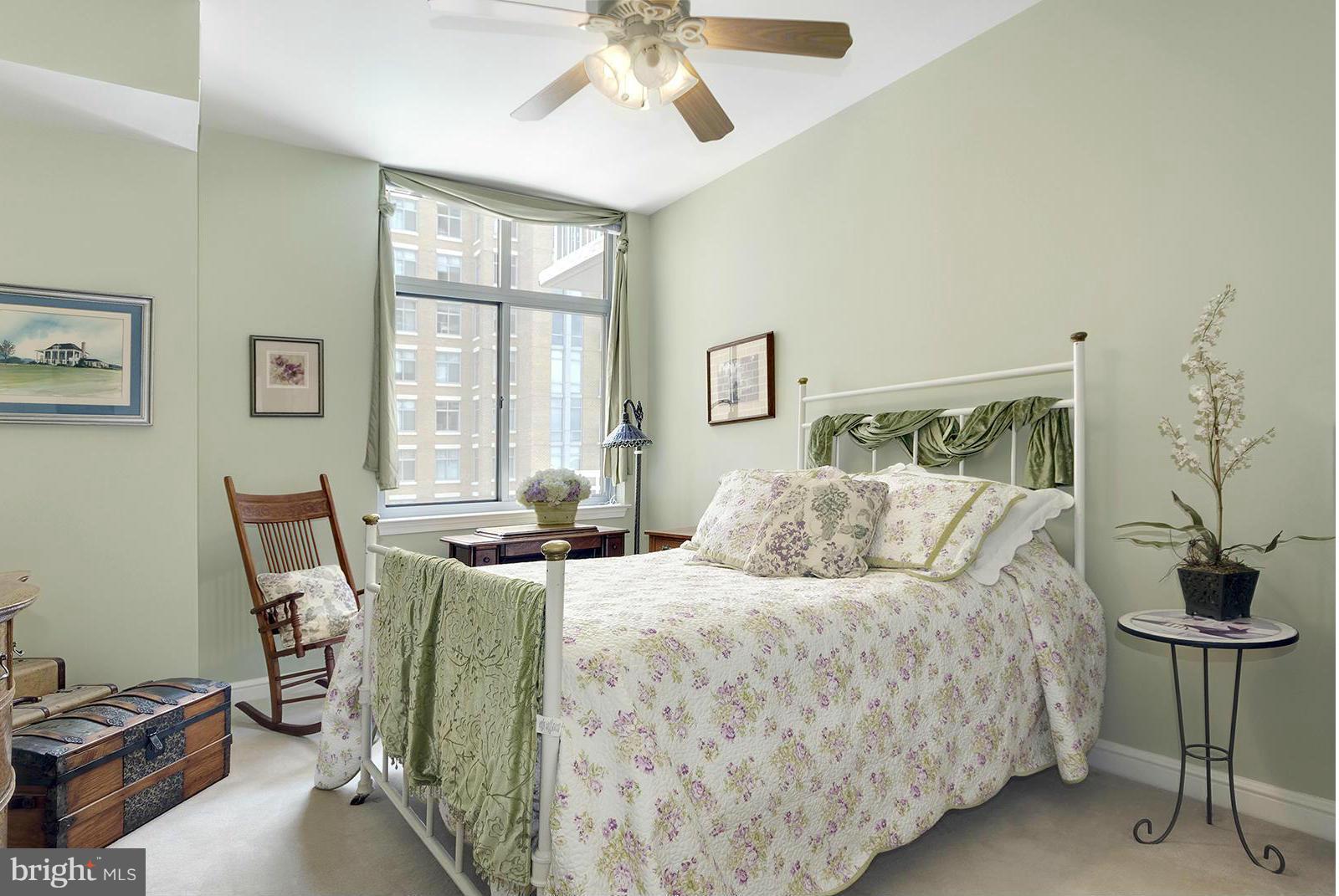 11990 Market Street, Unit 801 Reston, VA 20190 - Photo 15 of 25 a bedroom with a bed and a window
