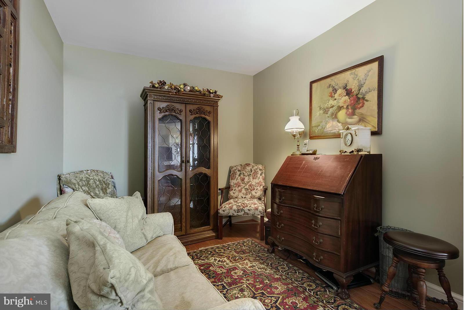 11990 Market Street, Unit 801 Reston, VA 20190 - Photo 17 of 25 a living room with furniture and a fireplace