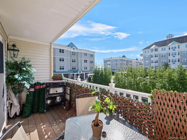 a balcony with furniture and flowers