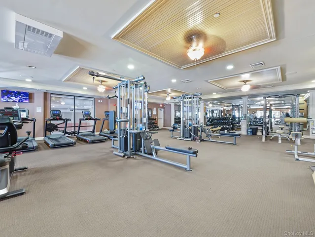 a view of a cafe with a couple of table and chairs in patio