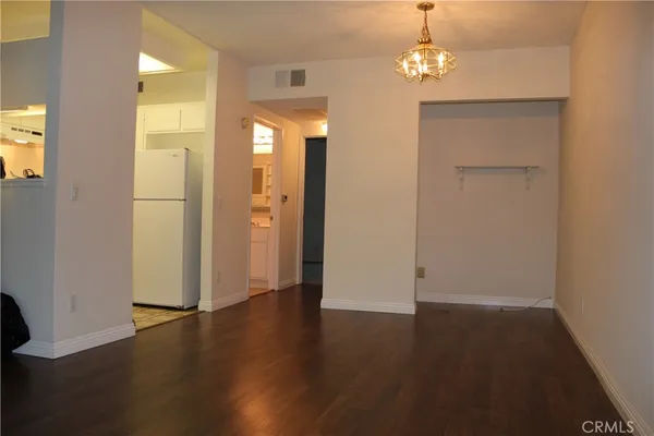 a view of a livingroom with wooden floor