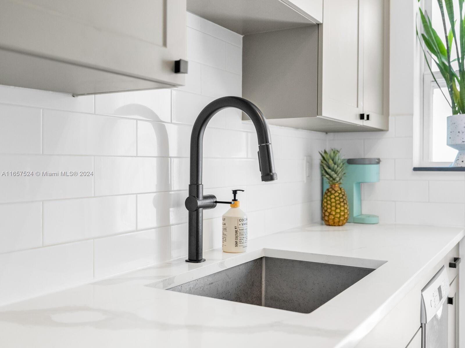742 12th Street, Unit 2 Miami Beach, FL 33139 - Photo 16 of 27 a close view of a sink and tap