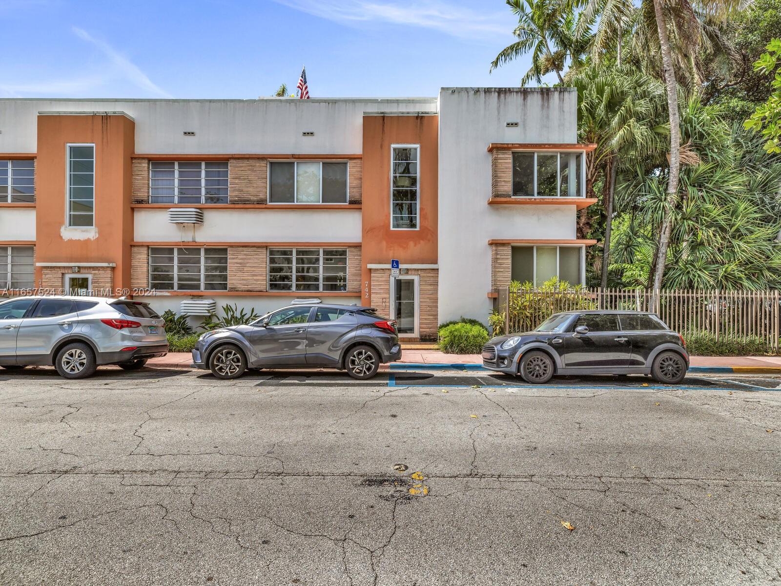 742 12th Street, Unit 2 Miami Beach, FL 33139 - Photo 5 of 27 a car parked in front of a big house