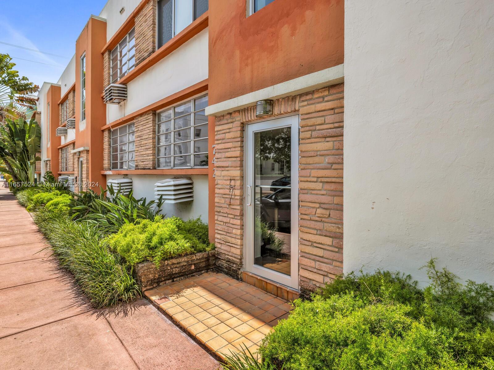 742 12th Street, Unit 2 Miami Beach, FL 33139 - Photo 6 of 27 a front view of a house with garden
