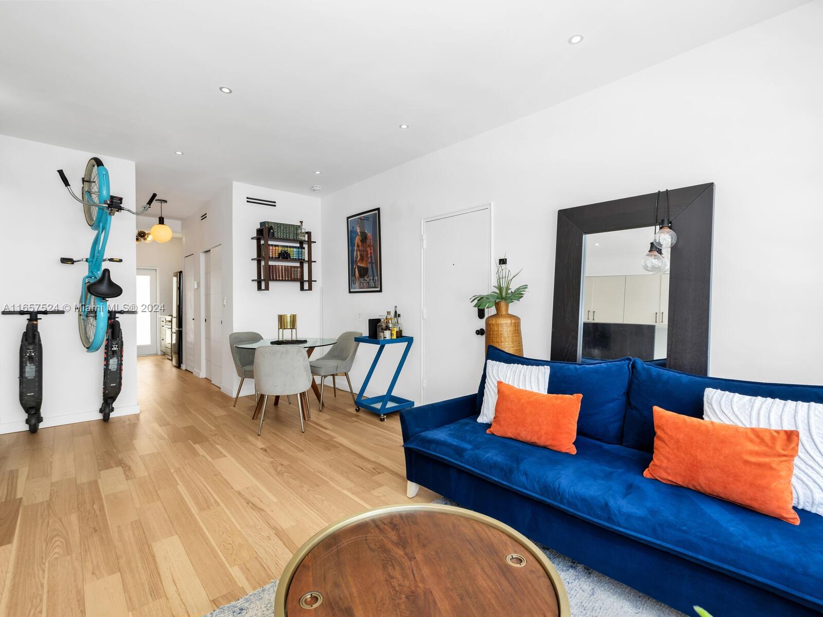 742 12th Street, Unit 2 Miami Beach, FL 33139 - Photo 7 of 27 a living room with furniture and wooden floor