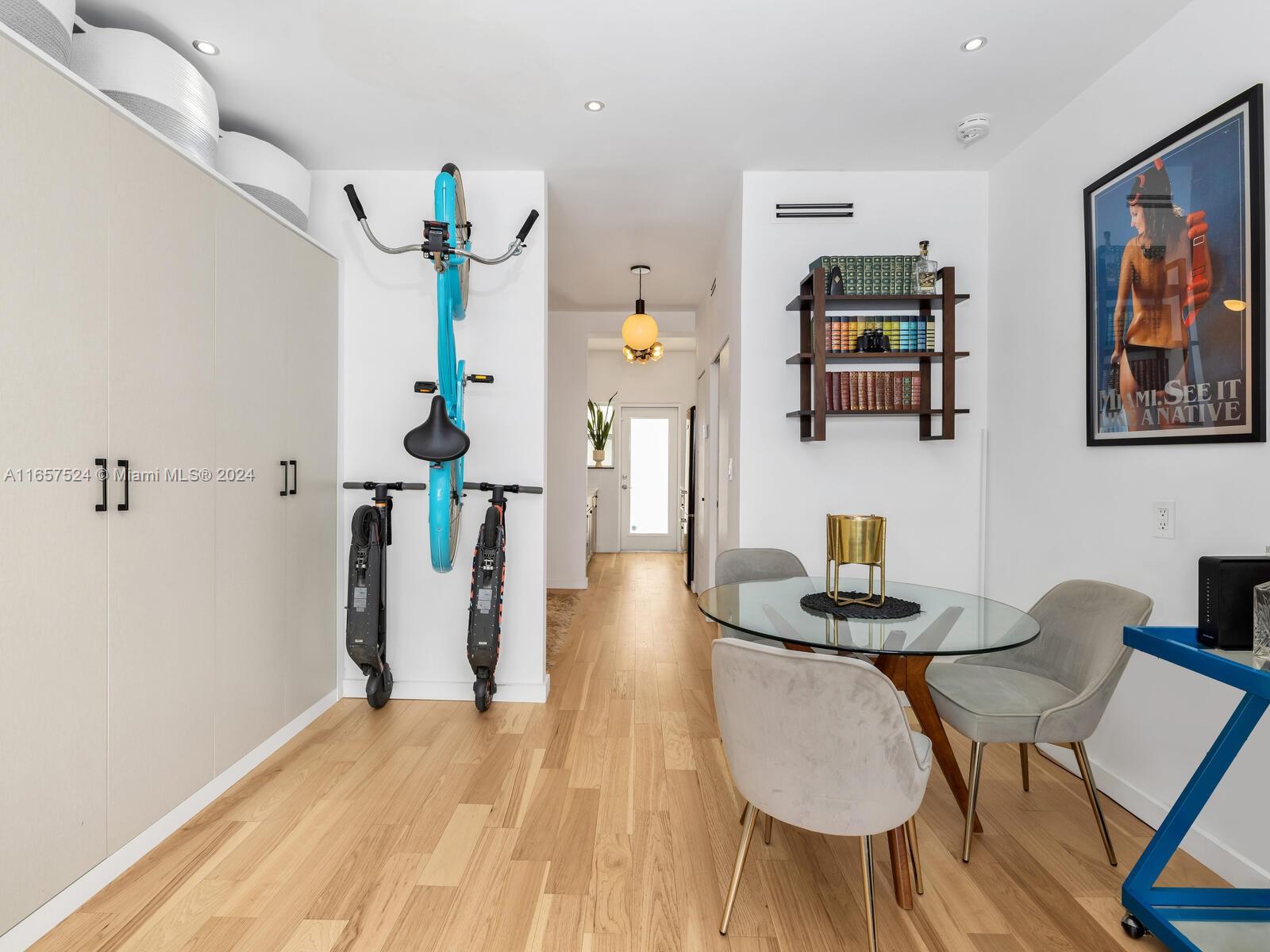 742 12th Street, Unit 2 Miami Beach, FL 33139 - Photo 9 of 27 a view of a workspace with furniture and wooden floor