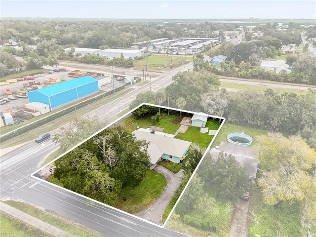 an aerial view of residential building and lake