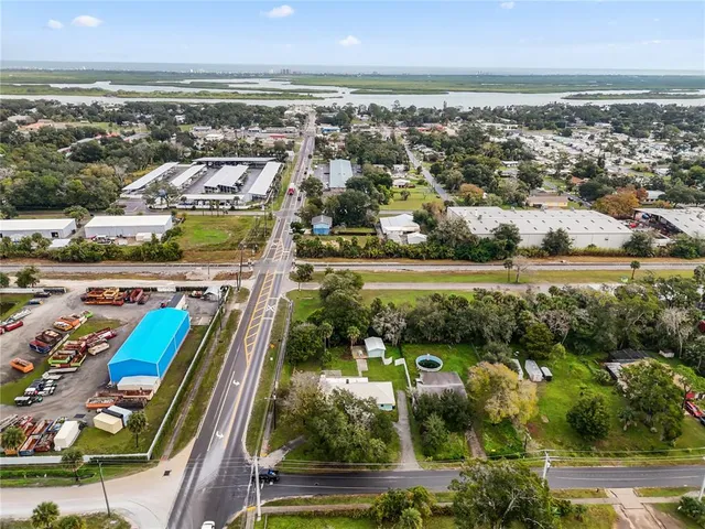 an aerial view of residential building and lake