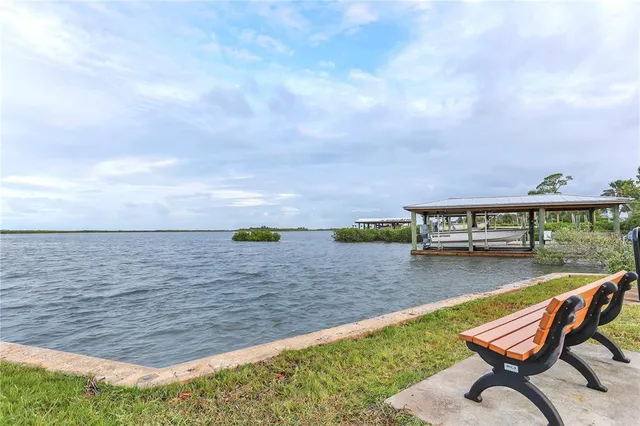 a view of swimming pool with seating area