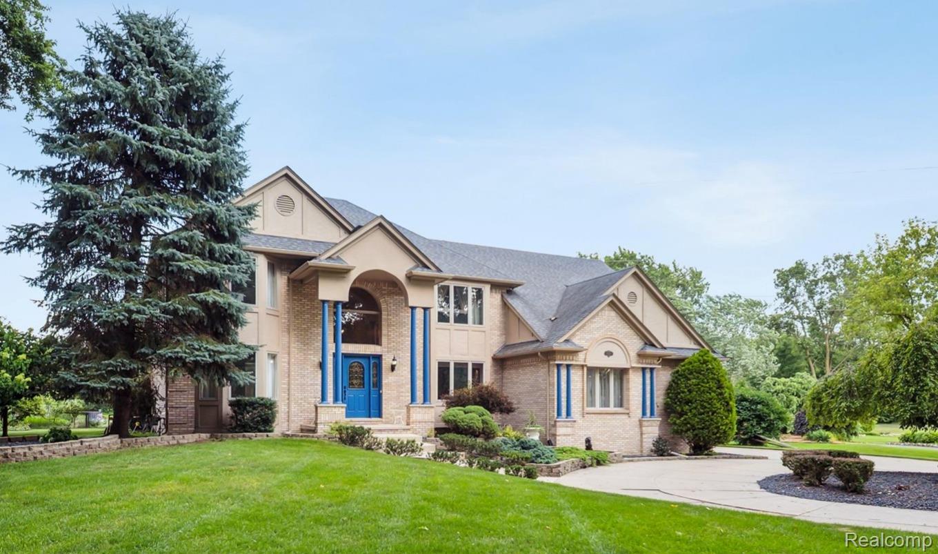 56764 Jewell Road Utica, MI 48315 - Photo 2 of 54 Brick and stucco exterior with a prominent arched entry