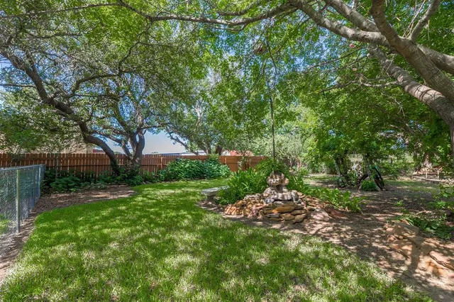 a backyard of a house with lots of green space