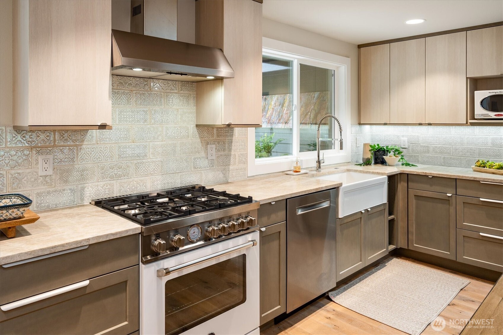 9503 Odin Way Bothell, WA 98011 - Photo 11 of 39 a kitchen with a stove and a sink