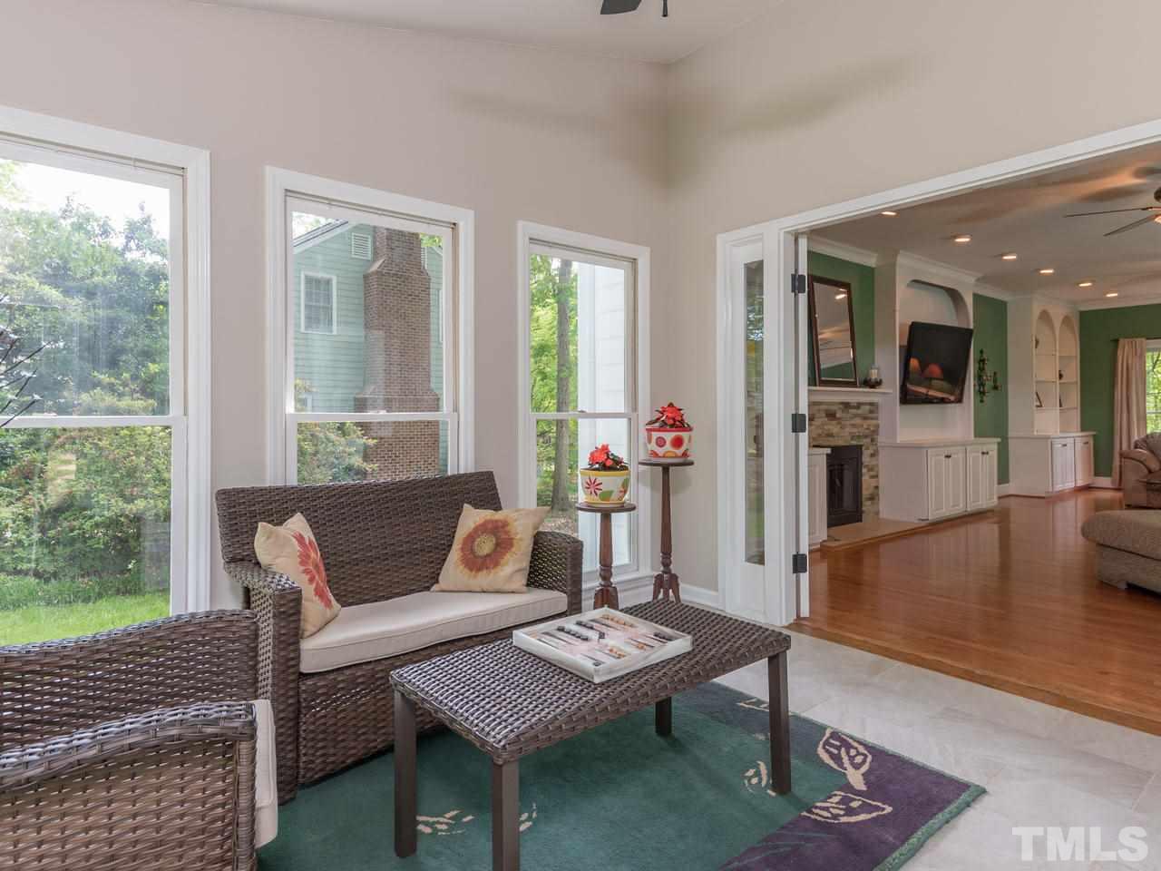 1401 October Road Raleigh, NC 27614 - Photo 14 of 30 a living room with furniture and a wooden floor