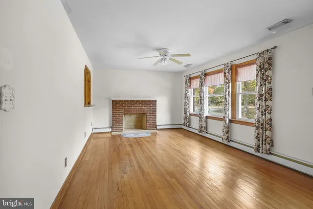 a living room with furniture fireplace and a flat screen tv