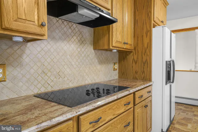 a bathroom with a granite countertop double vanity sink and a granite counter top