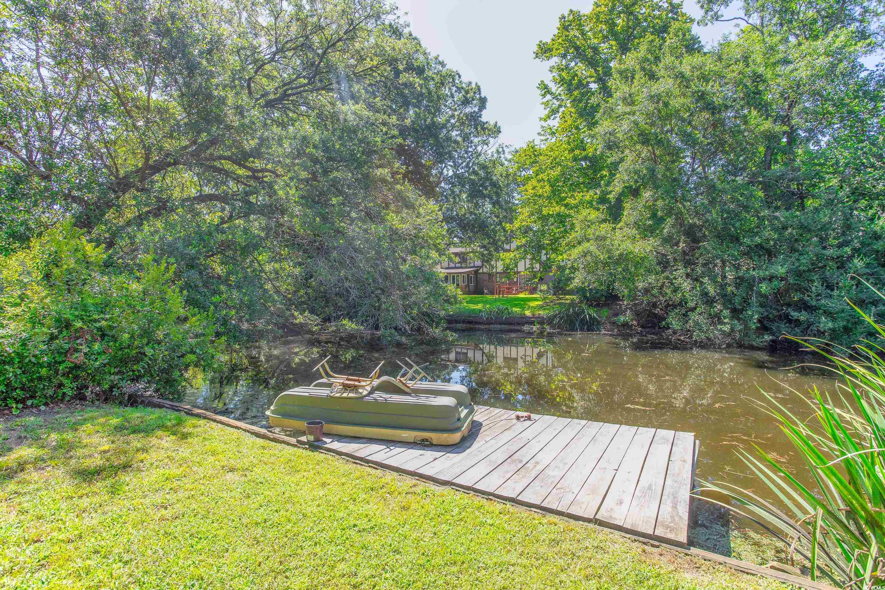 4907 Woodview Lane Myrtle Beach, SC 29575 - Photo 26 of 30 Dock with a water view and a yard