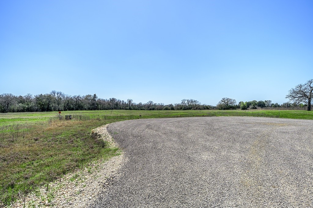 311 Lot 5 Feder Way Point West Point, TX 78963 - Photo 9 of 17 a view of a lake with houses in the background