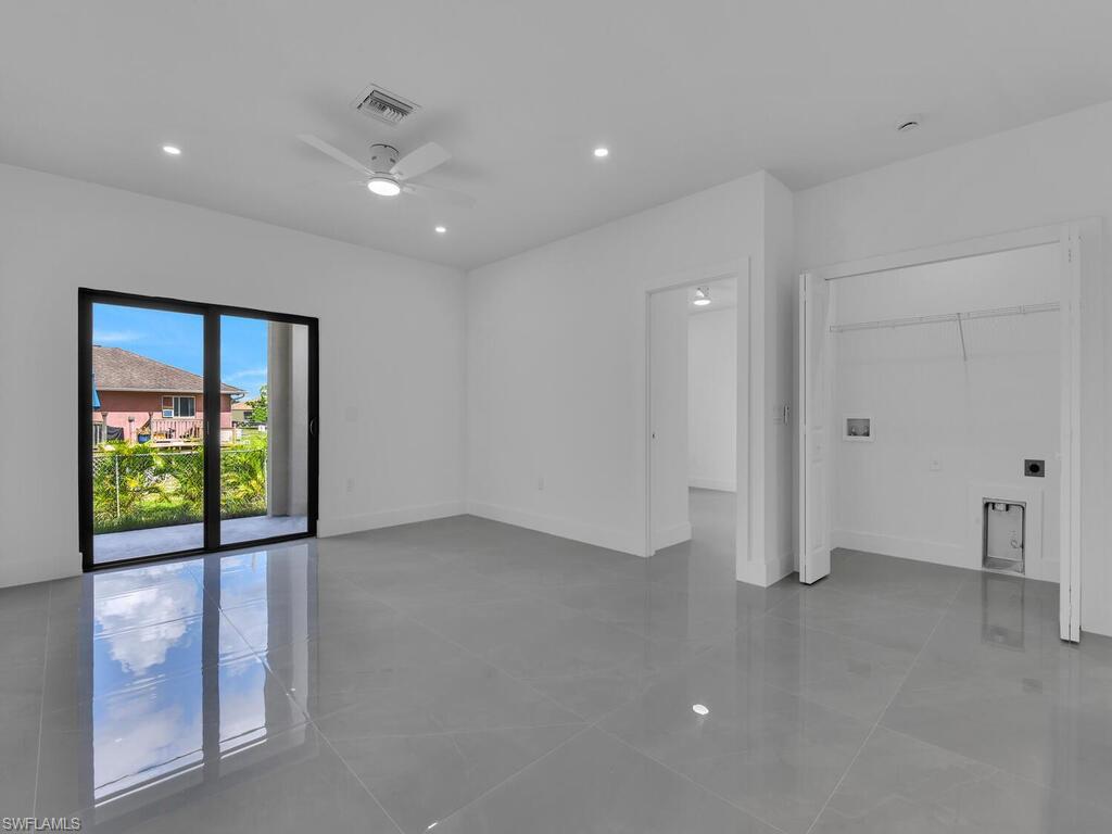 2212-2214 Wilson Road Lehigh Acres, FL 33973 - Photo 11 of 49 a view of an empty room with a window