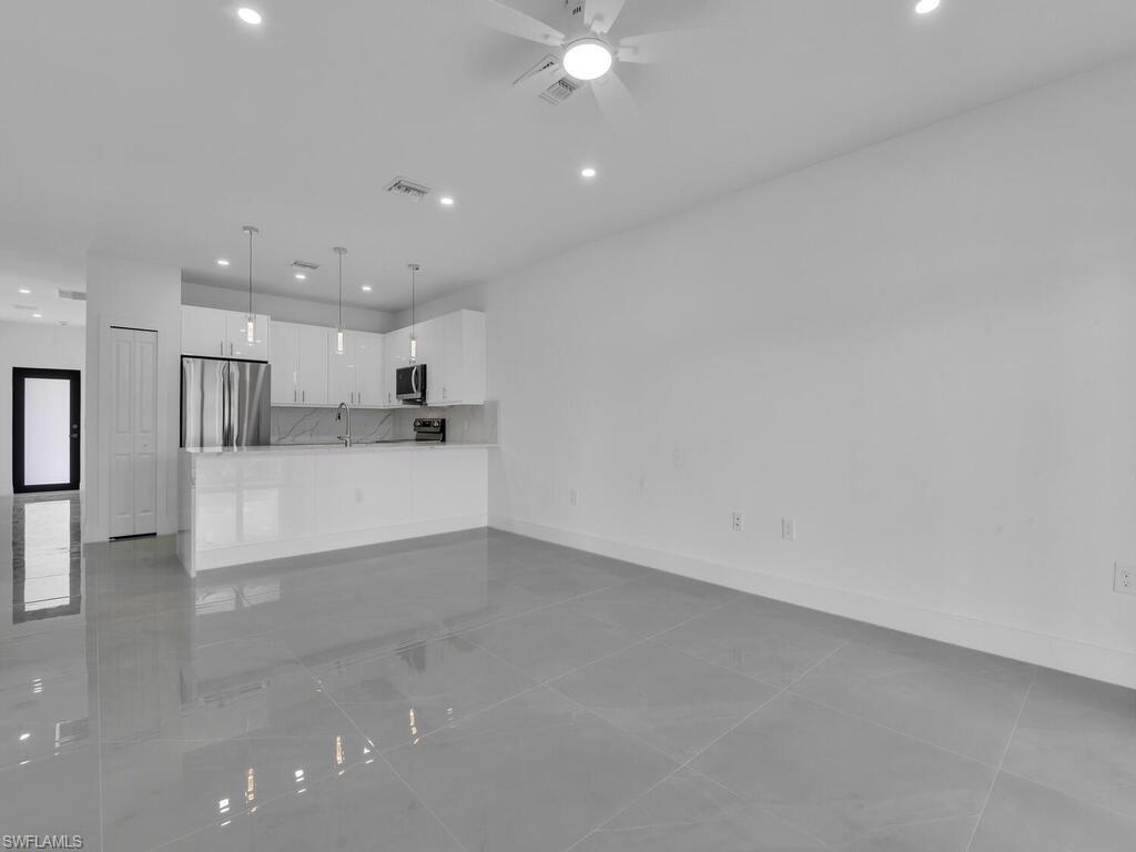 2212-2214 Wilson Road Lehigh Acres, FL 33973 - Photo 13 of 49 a view of a kitchen with a sink