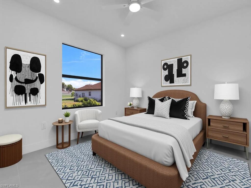 2212-2214 Wilson Road Lehigh Acres, FL 33973 - Photo 14 of 49 a bedroom with a bed and a couch