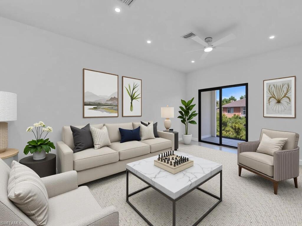 2212-2214 Wilson Road Lehigh Acres, FL 33973 - Photo 3 of 49 a living room with furniture and a large window