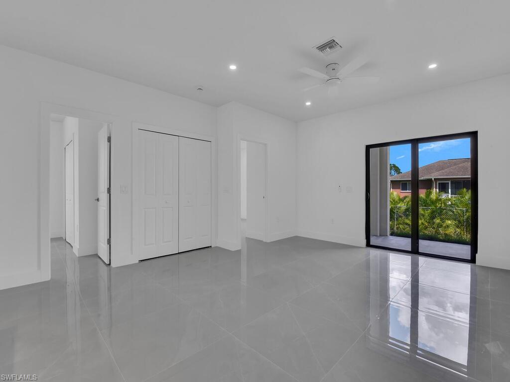 2212-2214 Wilson Road Lehigh Acres, FL 33973 - Photo 35 of 49 a view of an empty room with a window