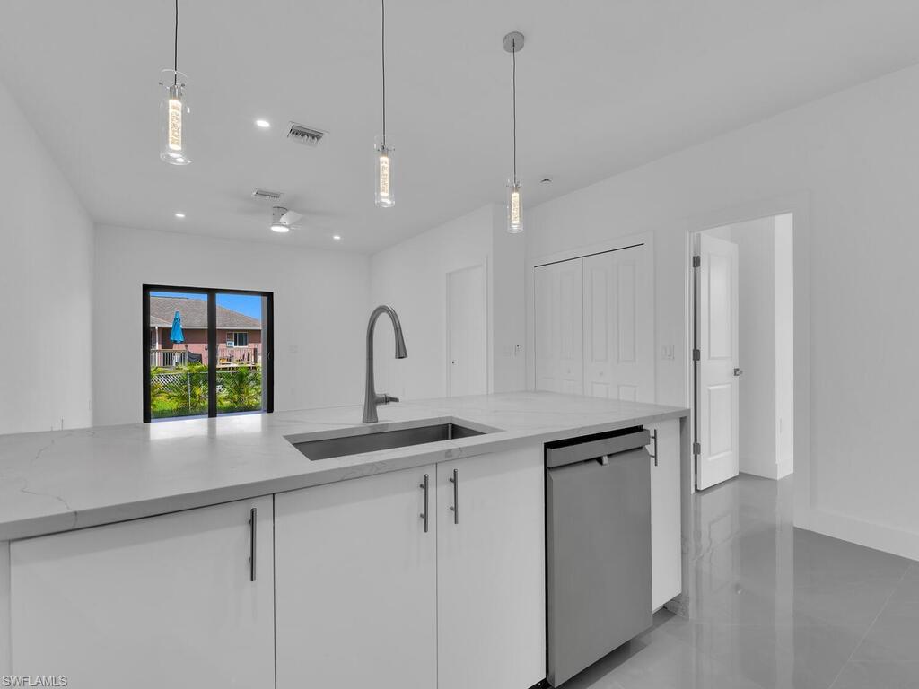 2212-2214 Wilson Road Lehigh Acres, FL 33973 - Photo 9 of 49 a kitchen with a sink and window