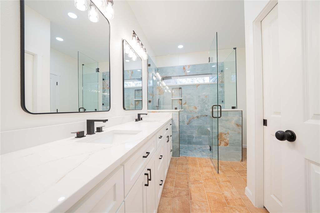 711 King Charles Road Scroggins, TX 75480 - Photo 22 of 39 a bathroom with a double vanity sink mirror and double