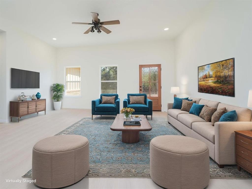 711 King Charles Road Scroggins, TX 75480 - Photo 3 of 39 a living room with furniture and a flat screen tv