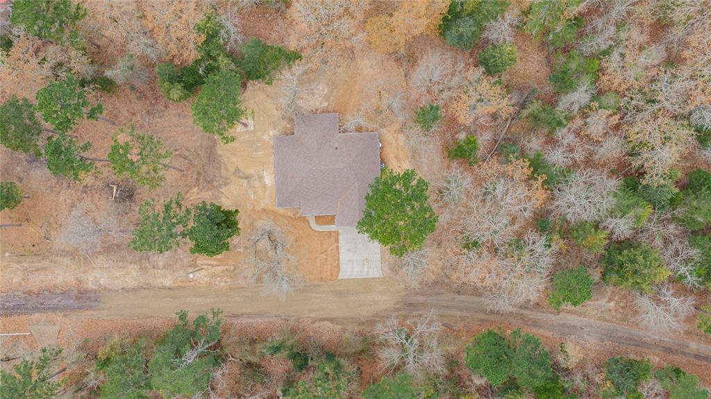 711 King Charles Road Scroggins, TX 75480 - Photo 37 of 39 an aerial view of a house with a yard