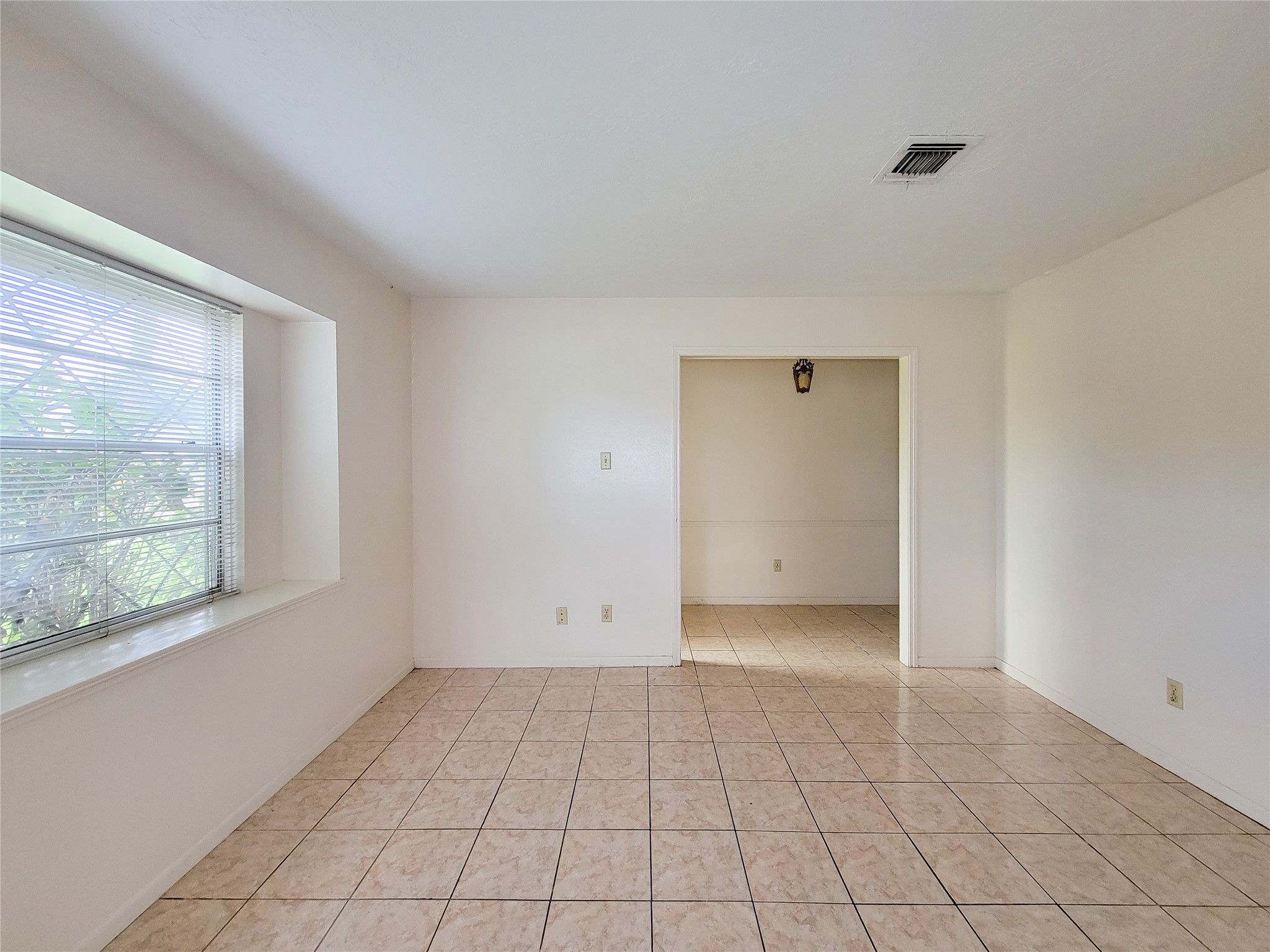 12215 Pompano Lane Houston, TX 77072 - Photo 13 of 44 a view of an empty room with a window