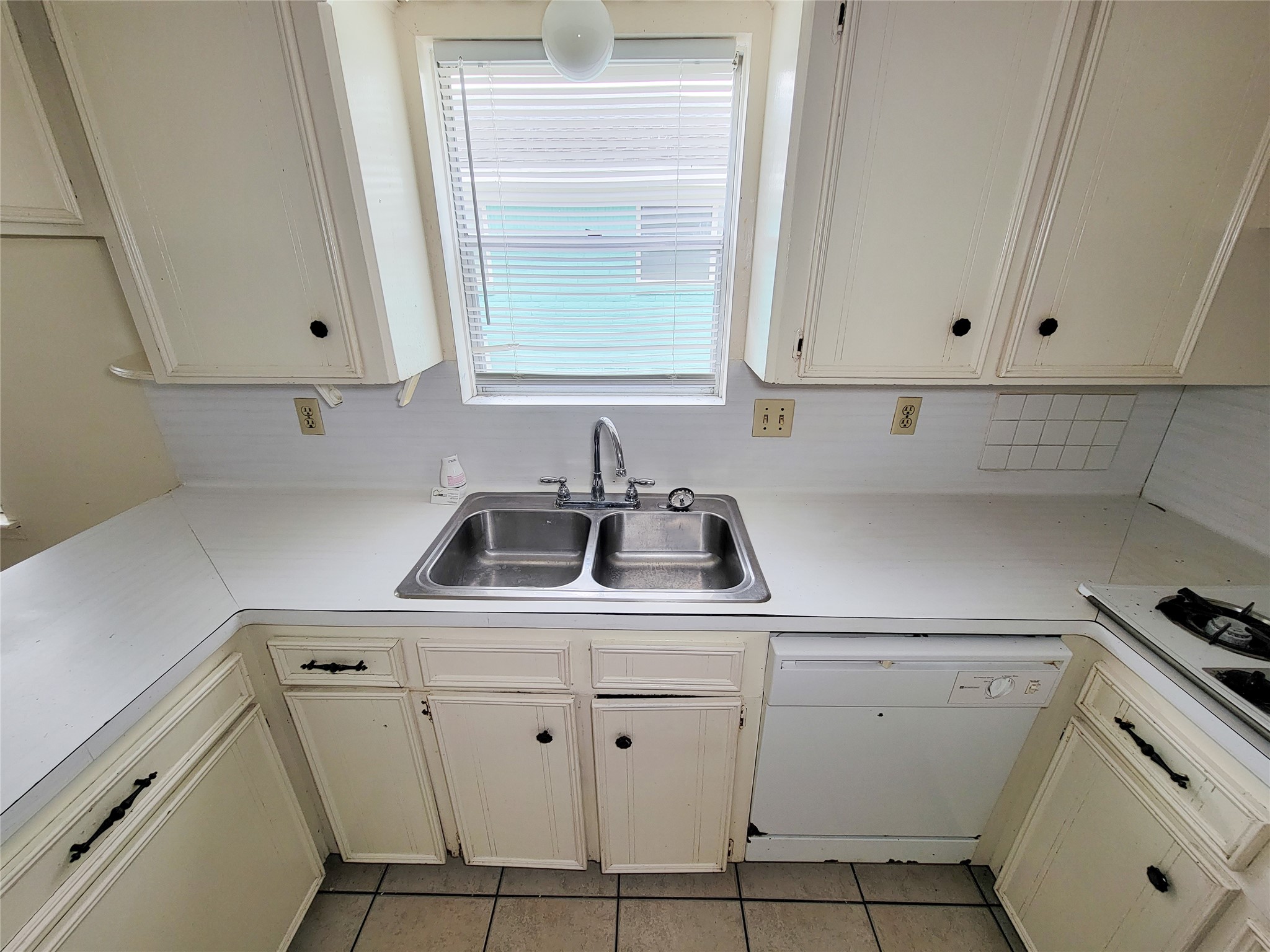 12215 Pompano Lane Houston, TX 77072 - Photo 22 of 44 a view of cabinets and sink