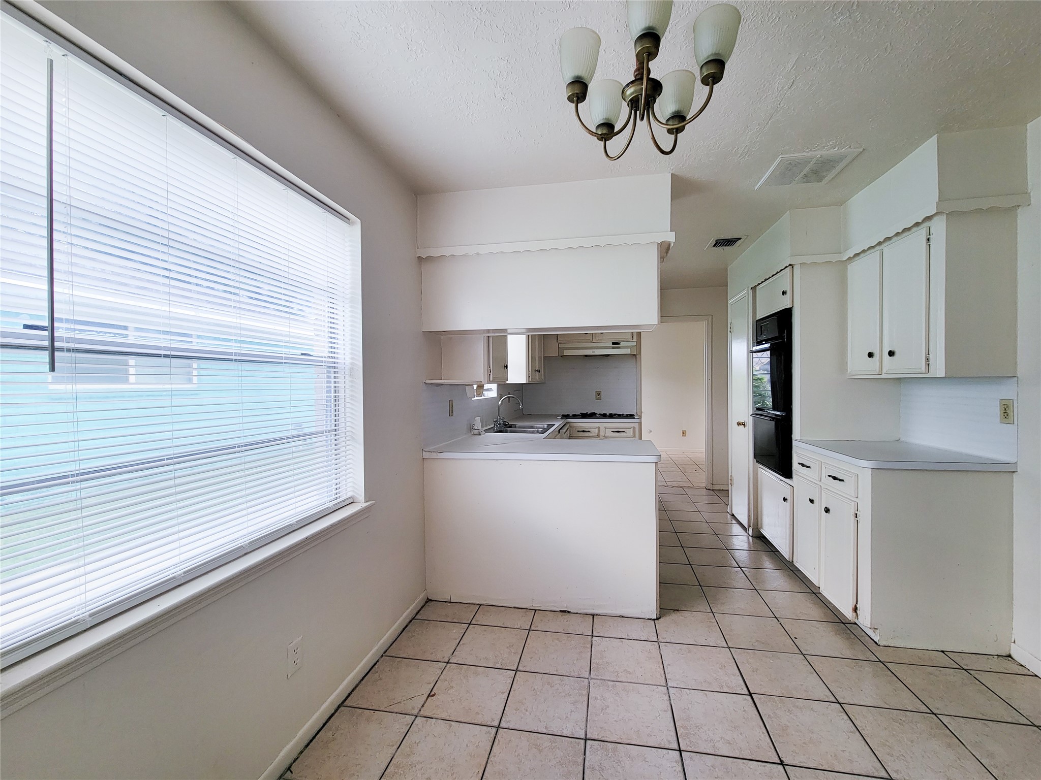 12215 Pompano Lane Houston, TX 77072 - Photo 23 of 44 a kitchen with a refrigerator a stove top oven a sink and dishwasher