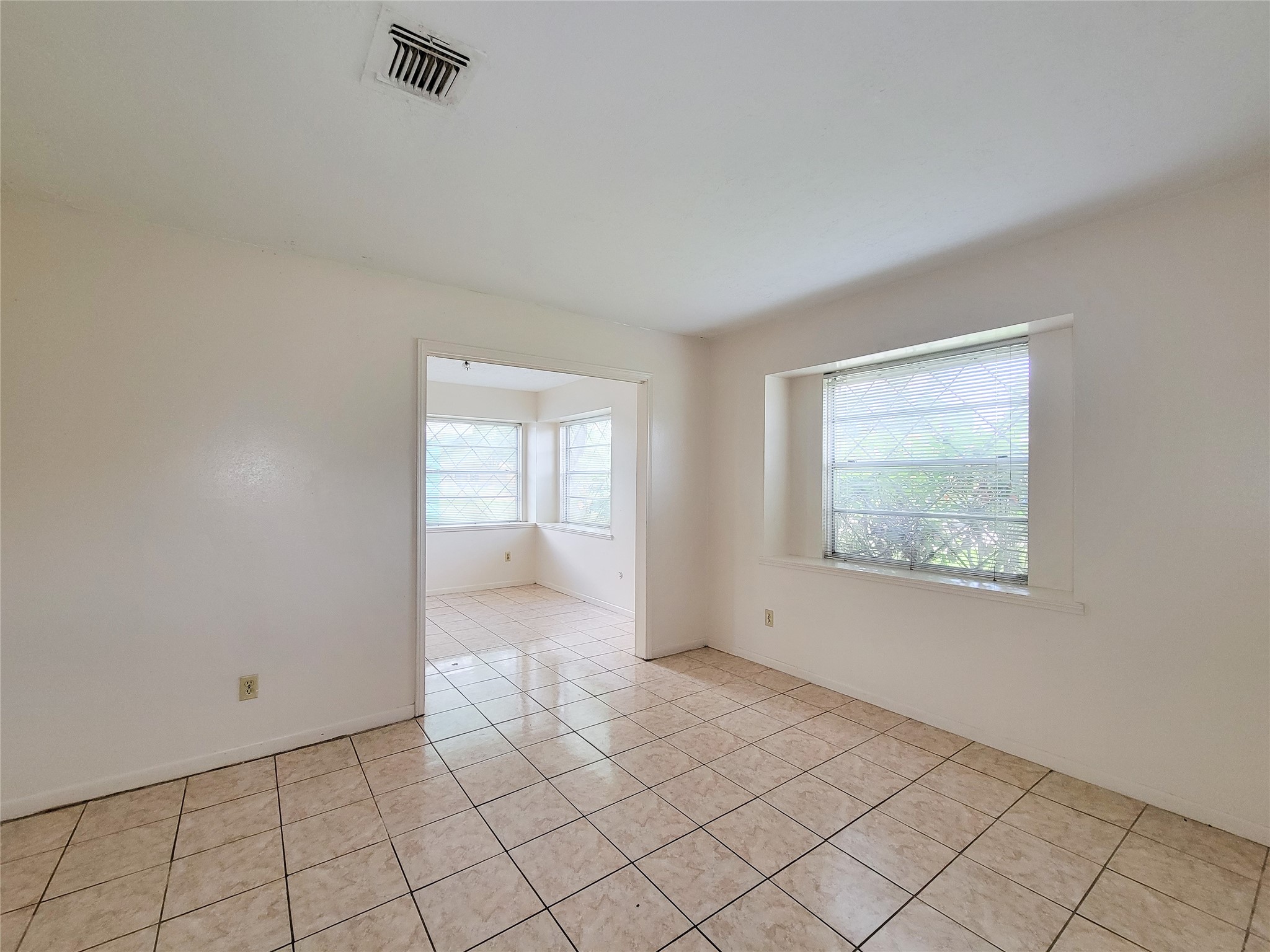 12215 Pompano Lane Houston, TX 77072 - Photo 9 of 44 a view of an empty room with window