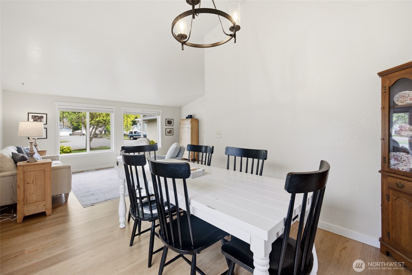 5725 58th Court Southeast Lacey, WA 98513 - Photo 11 of 36 a view of a dining room with furniture window and wooden floor