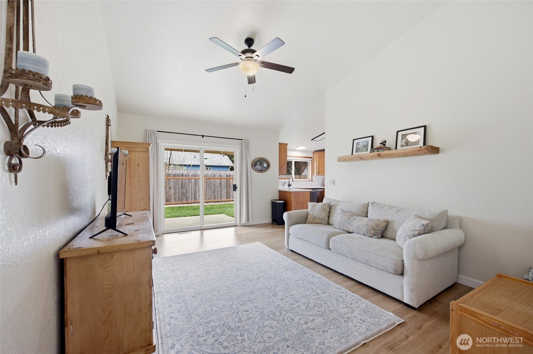 5725 58th Court Southeast Lacey, WA 98513 - Photo 18 of 36 a living room with furniture and a flat screen tv