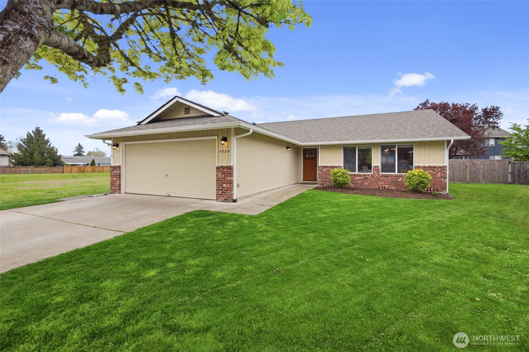 5725 58th Court Southeast Lacey, WA 98513 - Photo 2 of 36 a front view of a house with garden