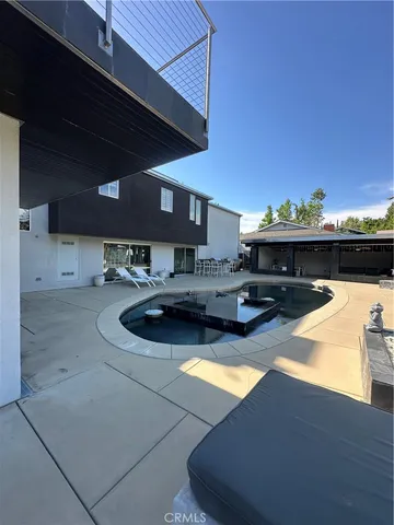 a kitchen with stainless steel appliances granite countertop a sink and a stove