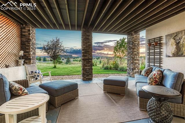 1935 Bashley Road Monument, CO 80132 - Photo 40 of 45 Steps from the recreation room, you can take advantage of the covered patio year round