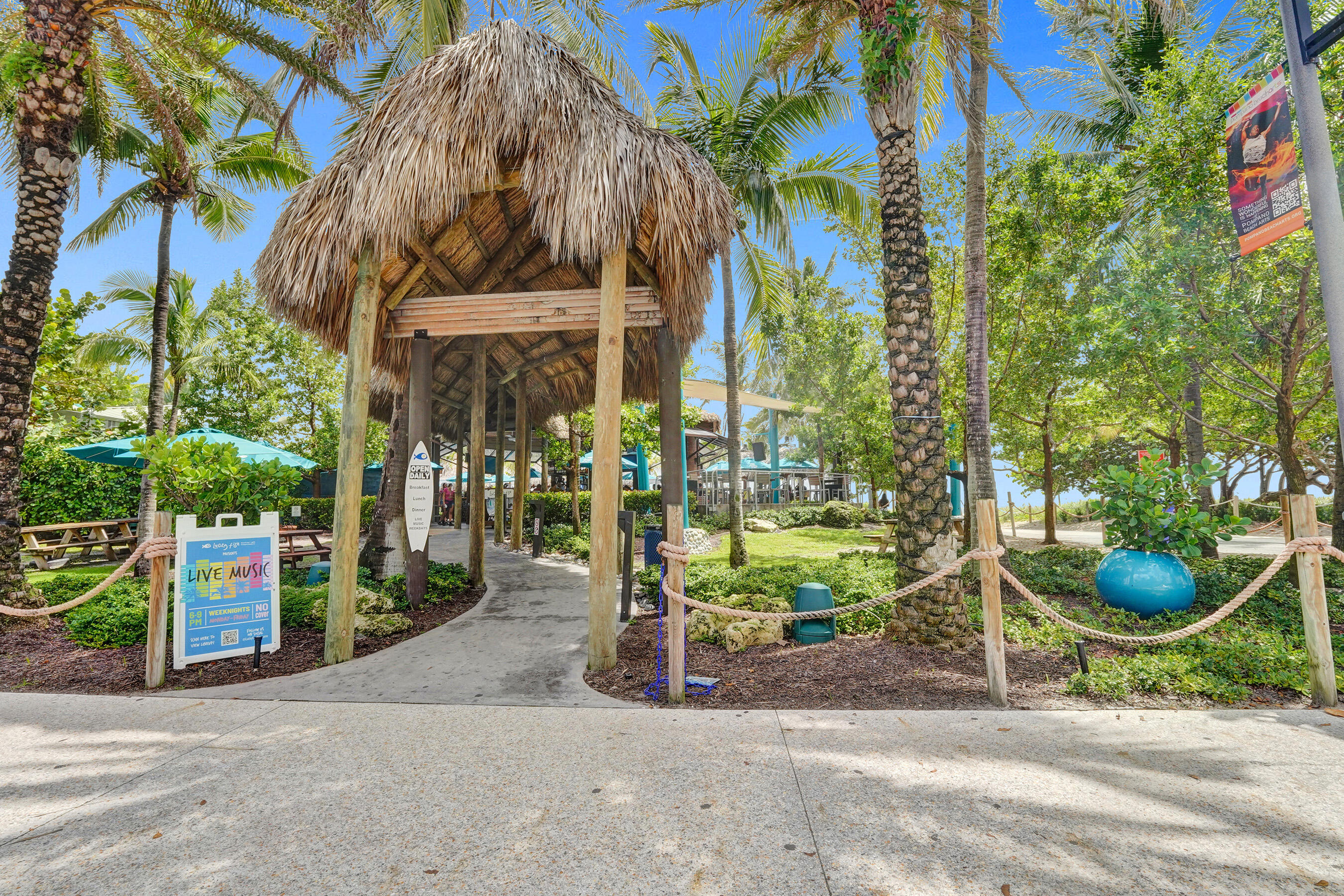 407 North Riverside Drive, Unit 602 Pompano Beach, FL 33062 - Photo 82 of 83 a backyard of a building with trees