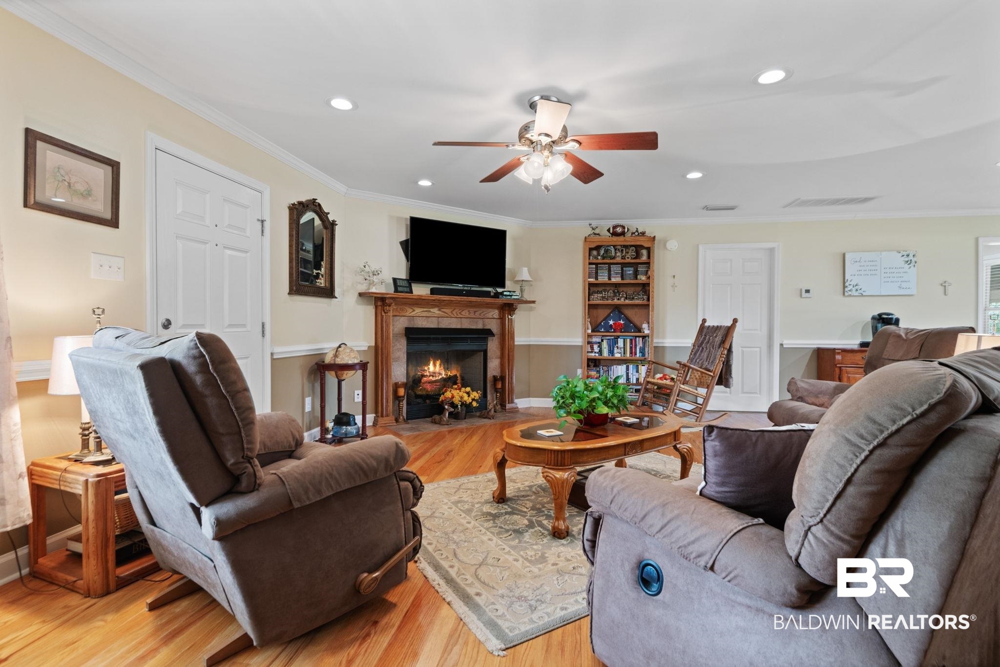 25871 Goat Cooper Road Robertsdale, AL 36567 - Photo 7 of 40 Living room featuring crown molding, light hardwood / wood-style flooring, and ceiling fan