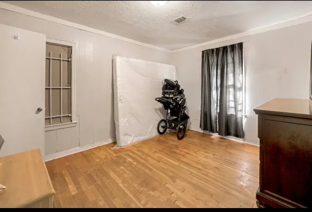 a bed room with a bed and a window