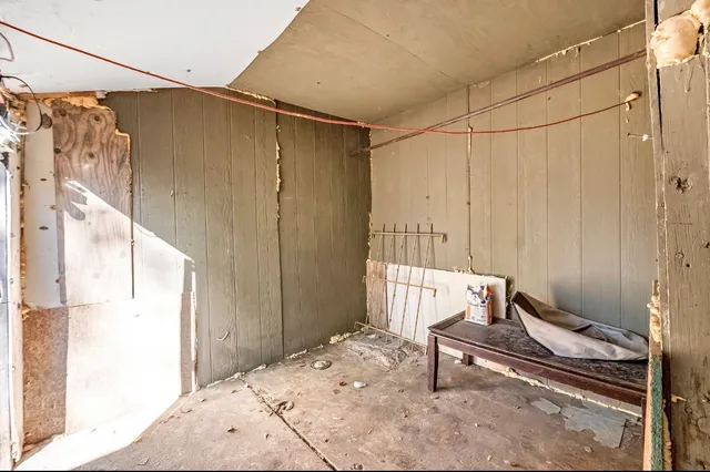 a bedroom with a bed and a table