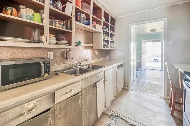 a kitchen with stainless steel appliances granite countertop a stove and a sink