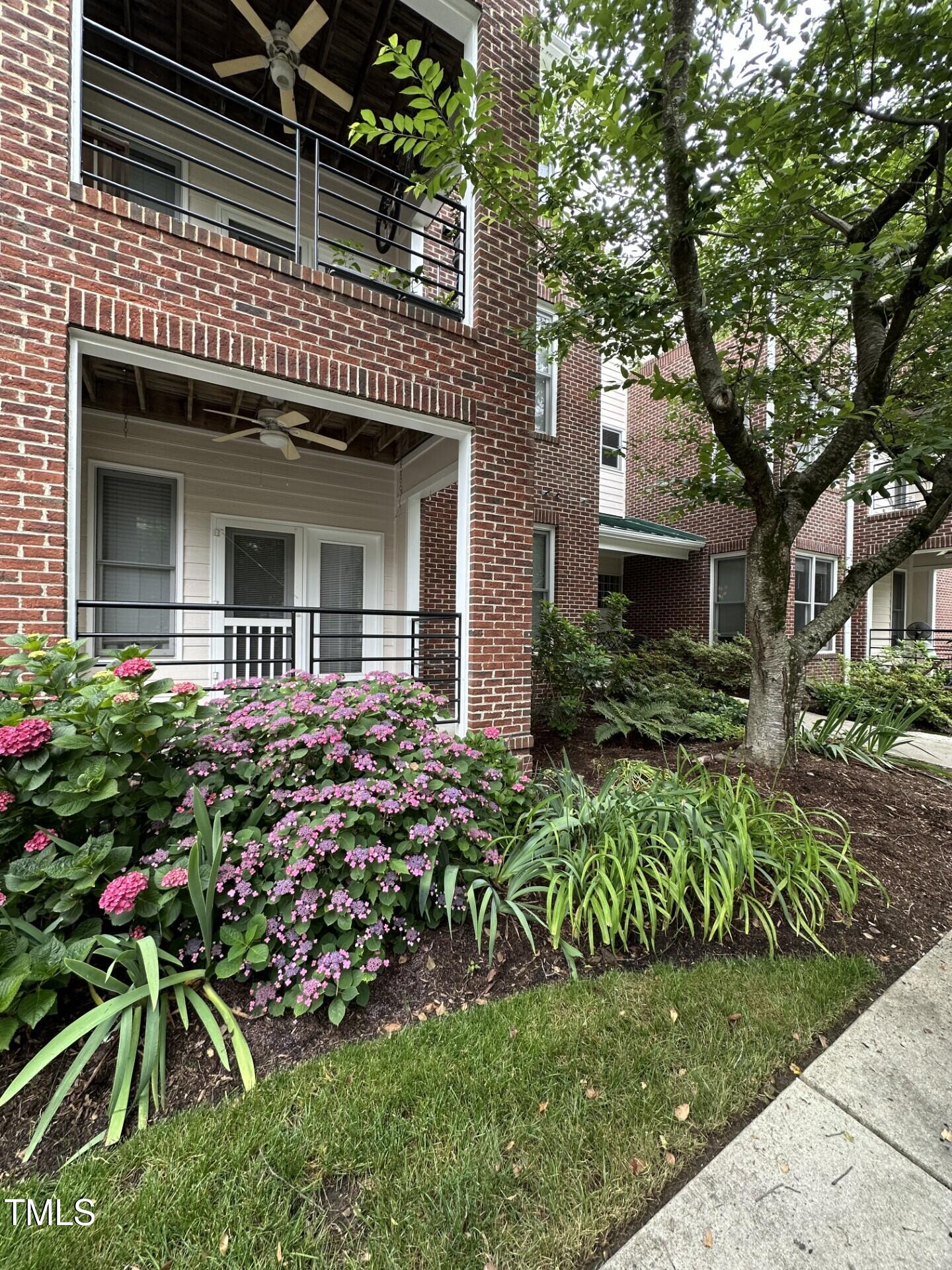 710 North Person Street, Unit 103 Raleigh, NC 27604 - Photo 1 of 16 a front view of a house with a garden